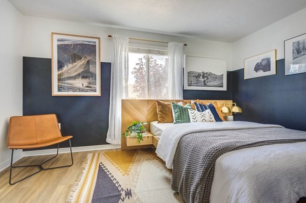 Cozy bedroom with elegant decor at Copperwood Apartments