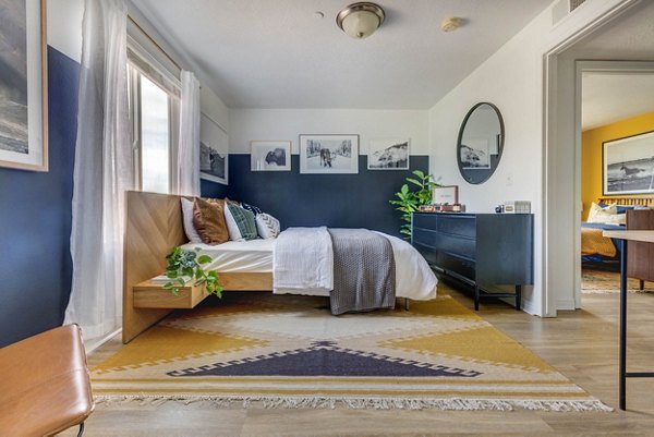 Bedroom featuring cozy decor and natural light in Copperwood Apartments