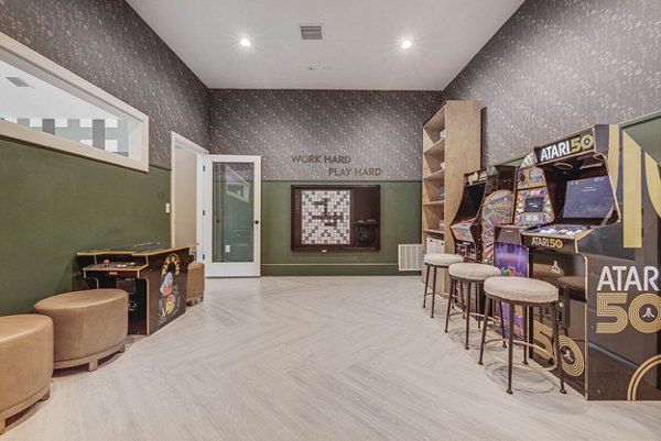 Game room featuring billiards and lounge seating at Copperwood Apartments