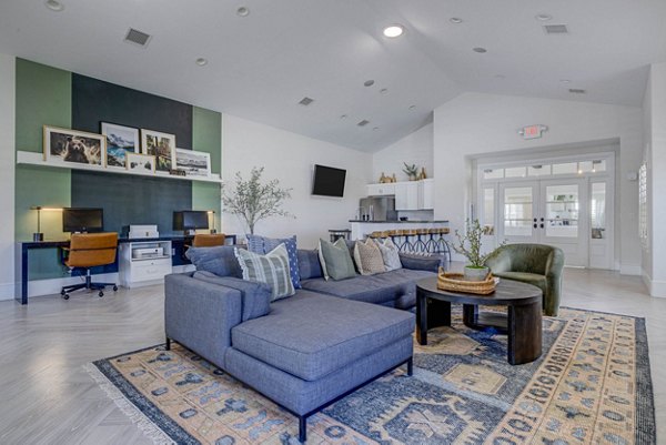 Clubhouse featuring modern design and cozy seating at Copperwood Apartments