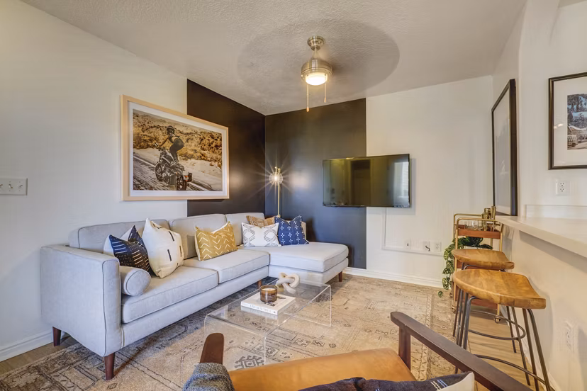 Cozy living room with modern decor and ample natural light at Copperwood Apartments