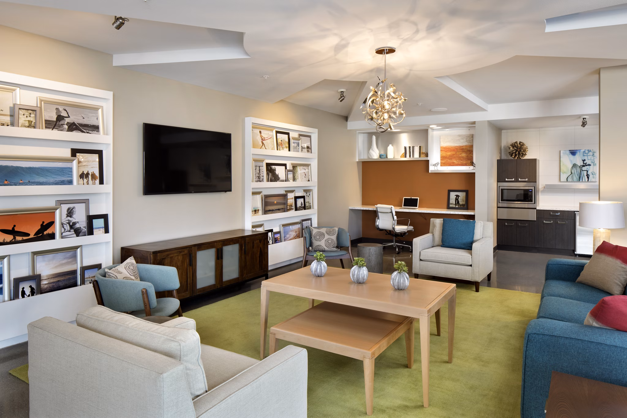 Clubhouse with modern furnishings at Pierside Apartments near waterfront Luxurious community spaces designed for relaxation and socializing