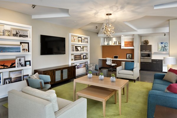 Clubhouse with modern furnishings at Pierside Apartments near waterfront Luxurious community spaces designed for relaxation and socializing