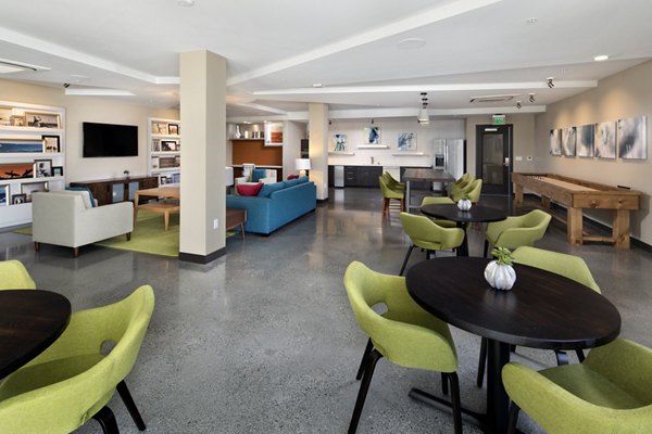 Clubhouse featuring modern design and lounge seating at Pierside Apartments, a luxury community in a coastal setting