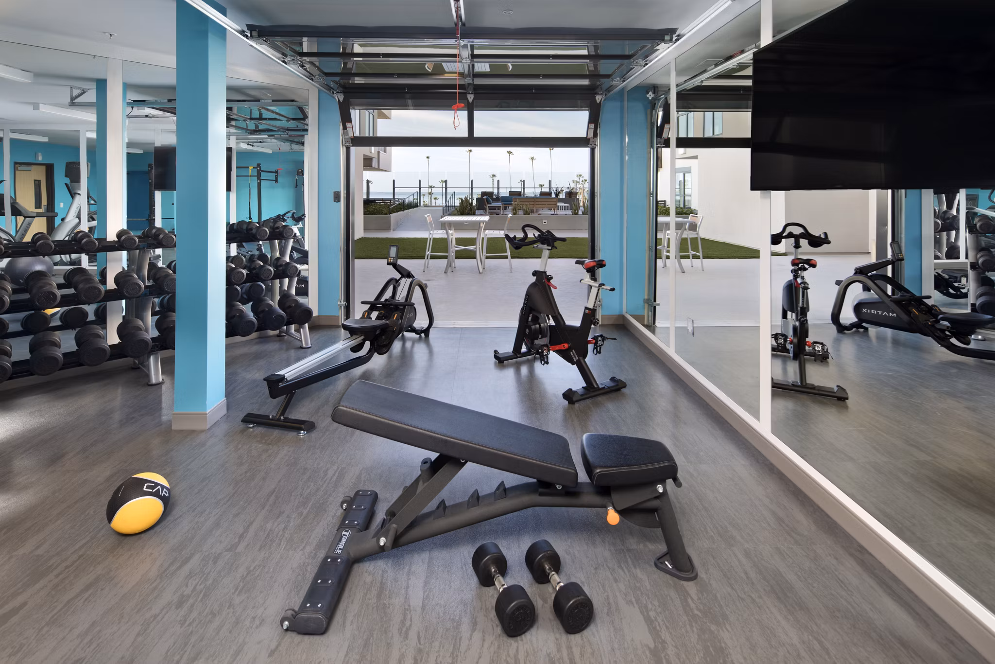 State-of-the-art fitness center with modern equipment at Pierside Apartments, offering luxury living and wellness amenities
