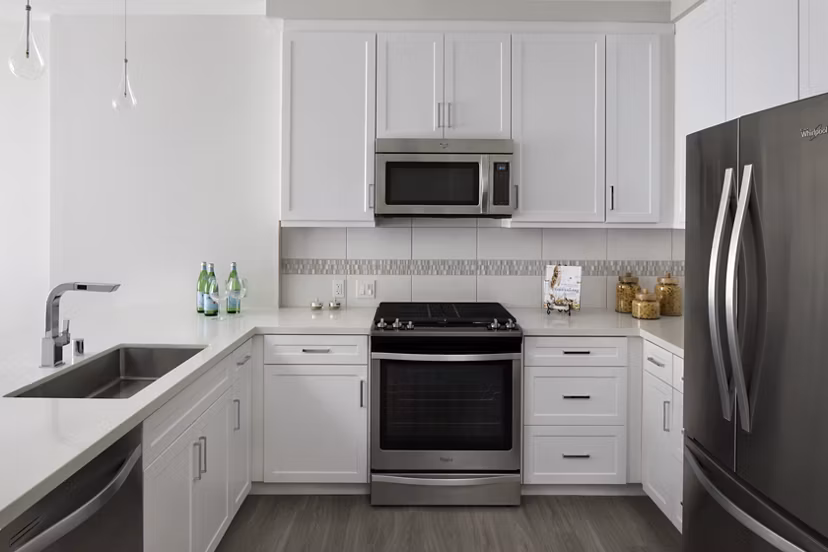 Modern kitchen with stainless steel appliances at Pierside Apartments