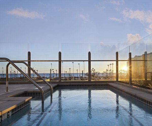 Inviting outdoor pool at Pierside Apartments offering luxury living near the waterfront
