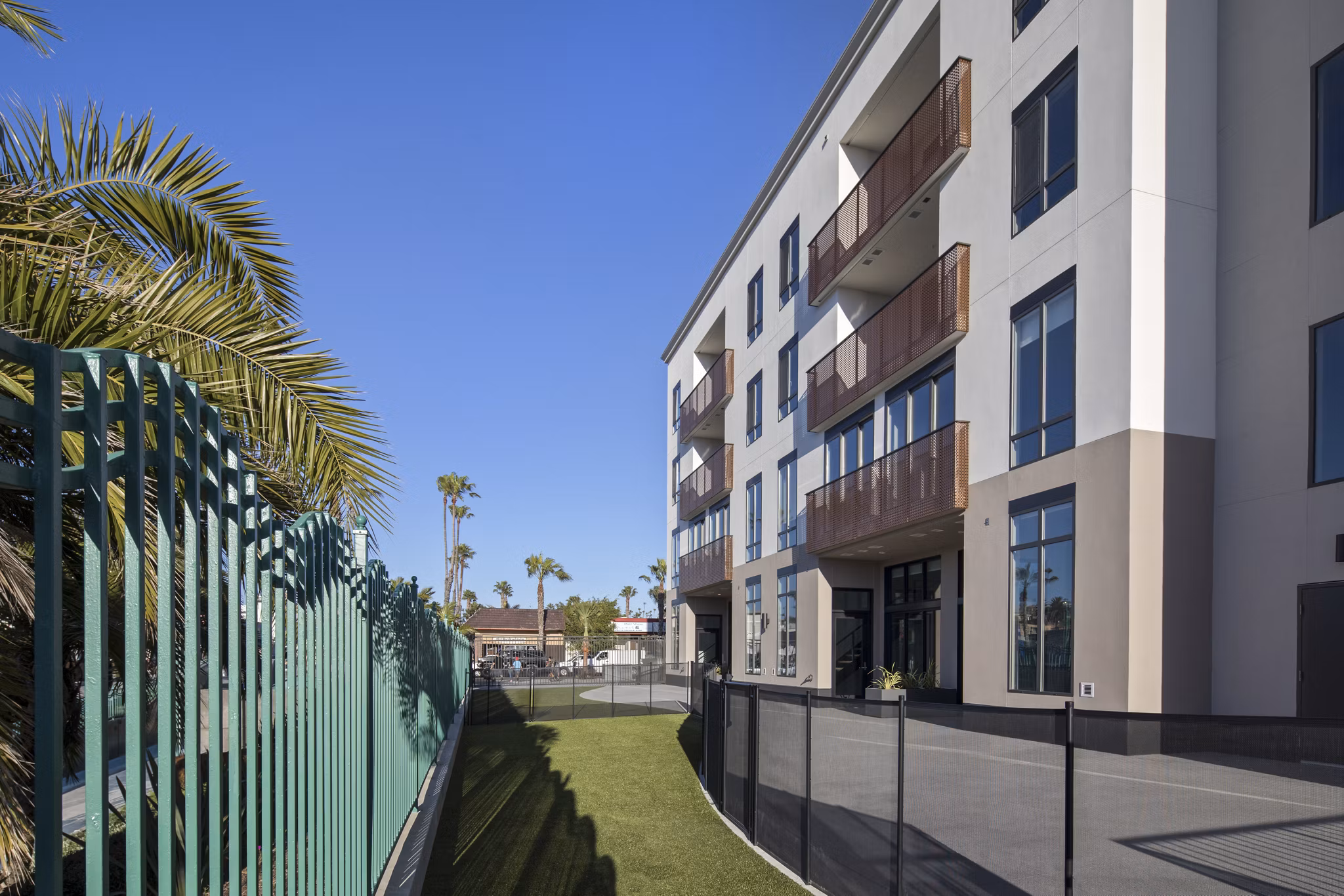 Spacious dog park with agility equipment at Pierside Apartments, perfect for pet-friendly living and outdoor fun