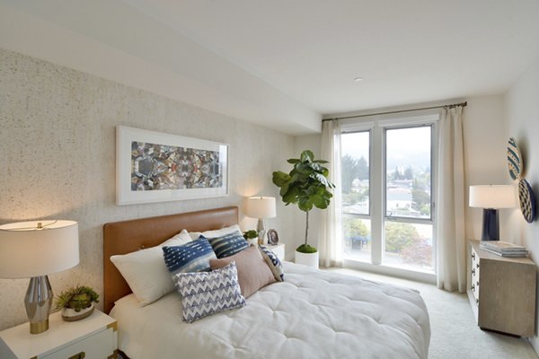 Cozy bedroom with modern furnishings at Parker luxury apartments