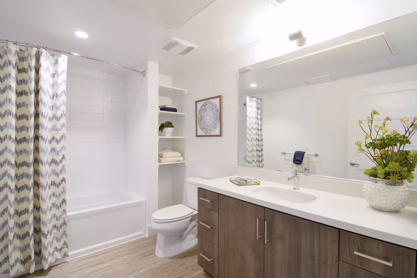 Parker: Elegant bathroom with sleek fixtures and marble countertops in luxury apartments