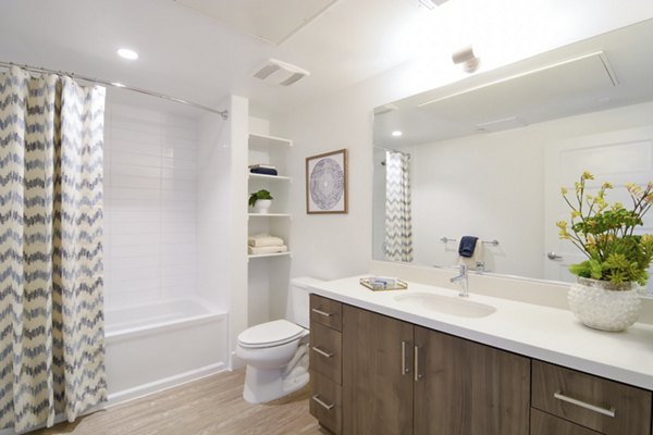 Parker: Elegant bathroom with sleek fixtures and marble countertops in luxury apartments