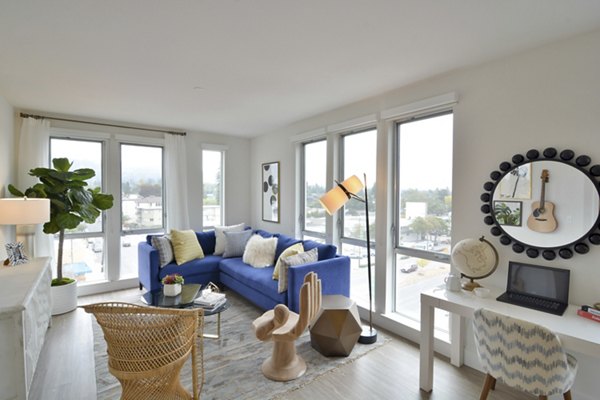 Living room with modern furnishings and natural light at Parker luxury apartments