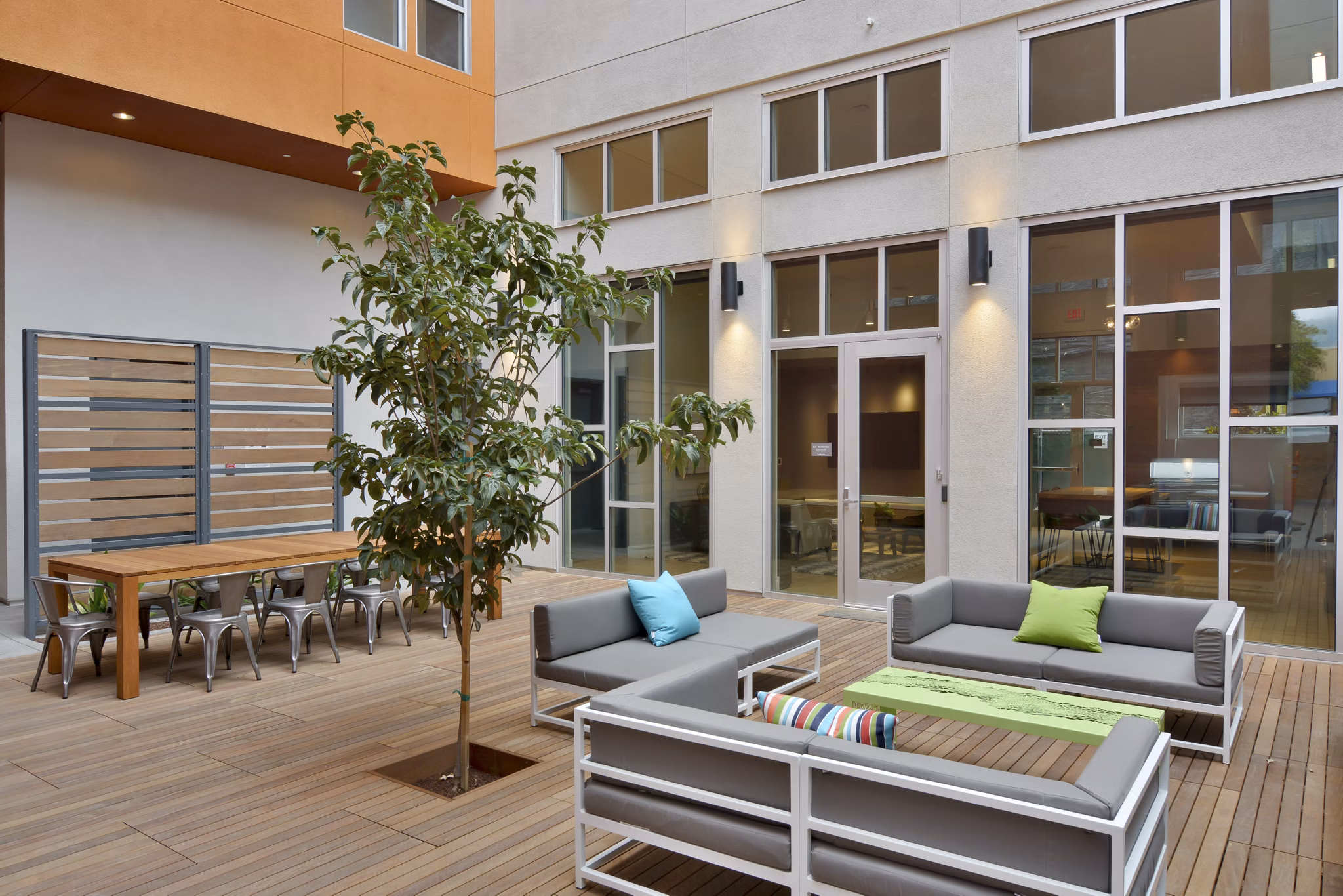 Parker Apartments: Cozy patio area with outdoor seating and lush greenery, perfect for relaxation and social gatherings