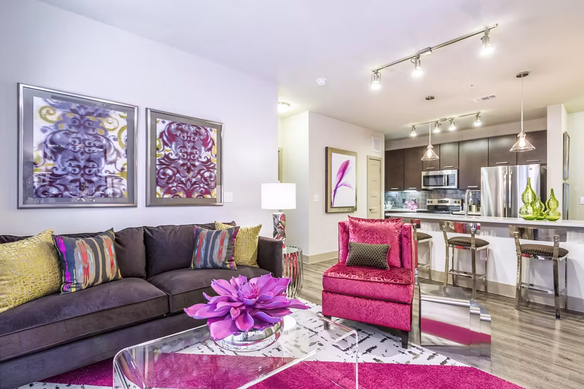 Bright living room with vibrant decor and open kitchen at Platform Apartments