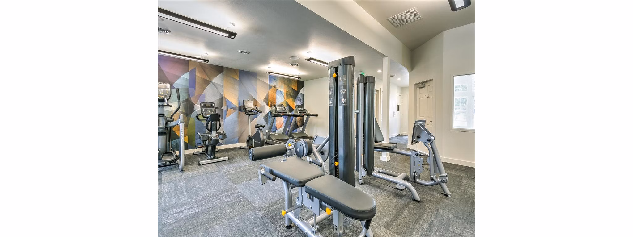 State-of-the-art fitness center with modern equipment at Rosewood Apartments