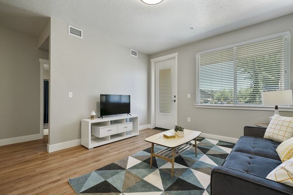 Spacious living room with modern decor at Rosewood Apartments