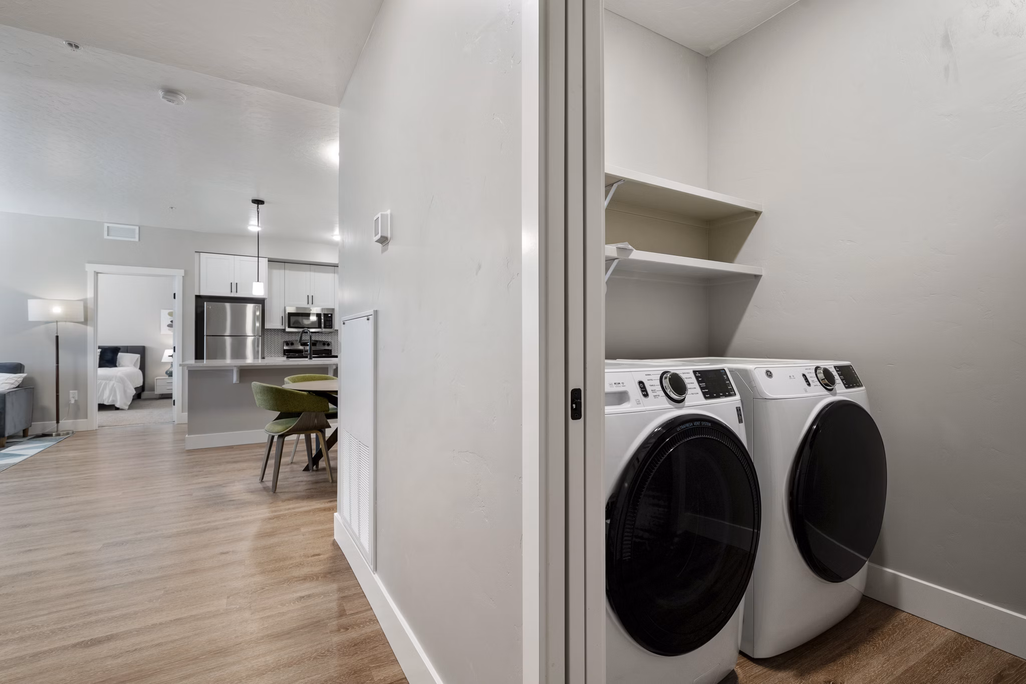 Laundry room featuring energy-efficient washers and dryers at Rosewood Apartments