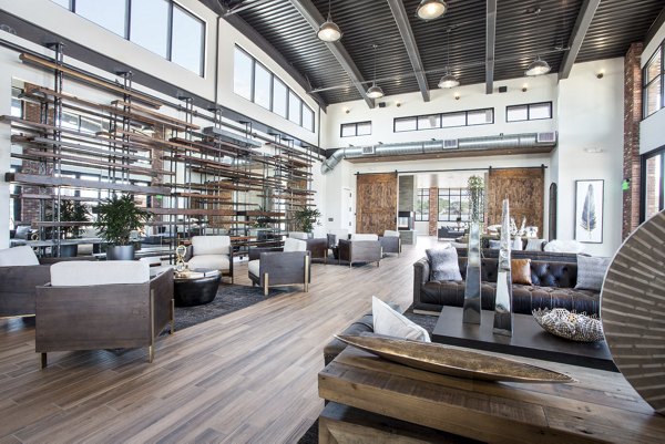 Modern clubhouse featuring sleek design and ample seating at 4th West Apartments