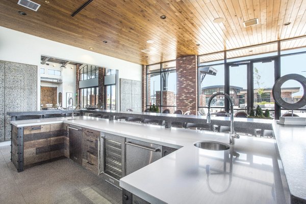 Stylish clubhouse with modern seating and ambient lighting at 4th West Apartments