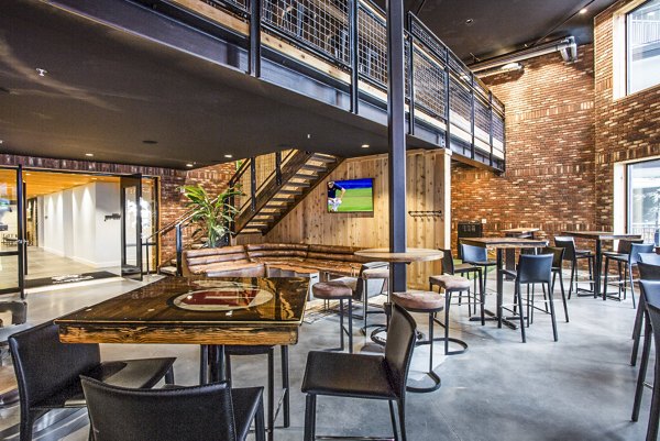 Contemporary clubhouse with modern decor and seating at 4th West Apartments