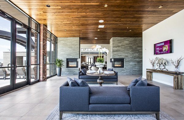 Clubhouse featuring modern design and ample seating at 4th West Apartments