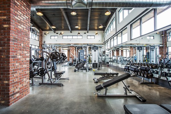 State-of-the-art fitness center with modern equipment at 4th West Apartments, catering to health enthusiasts seeking a luxurious workout experience