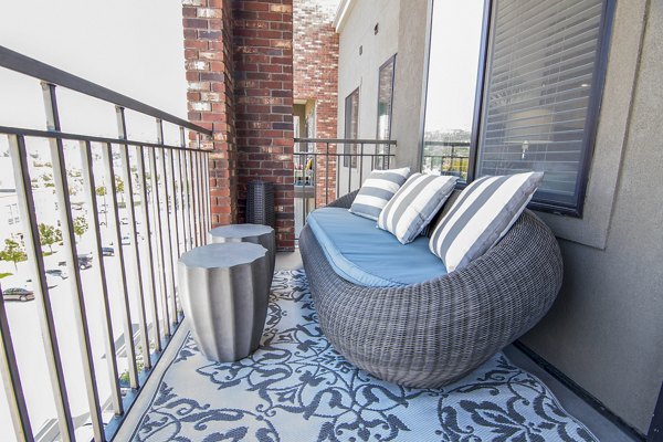 Spacious patio with urban views at 4th West Apartments, perfect for city living
