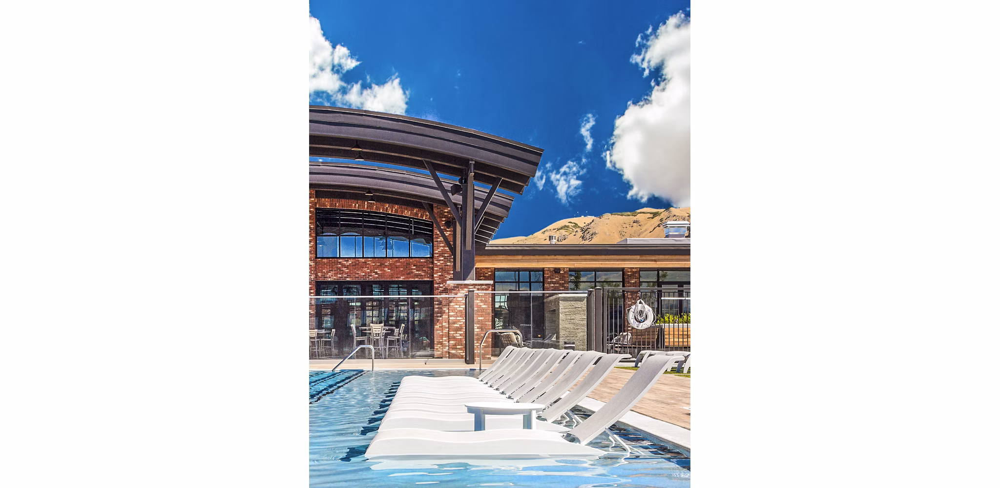 Infinity-edge pool at 4th West Apartments with skyline views