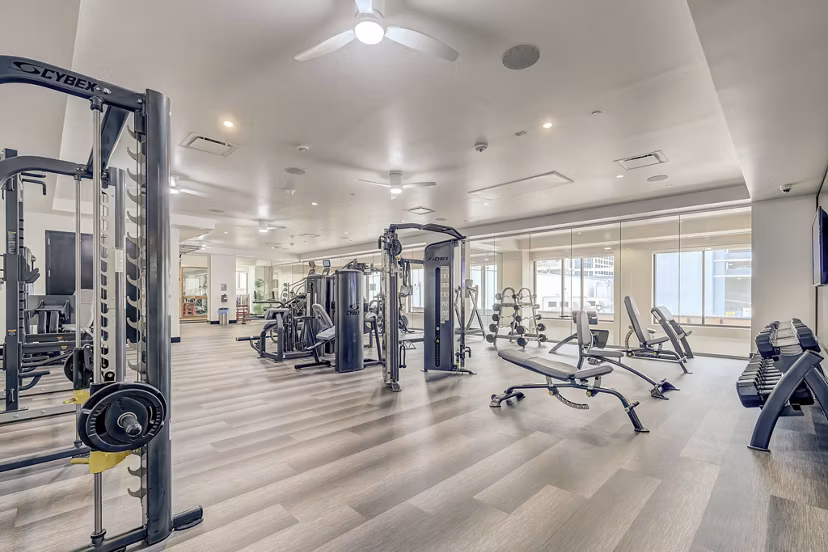 Modern fitness center with state-of-the-art equipment at Alara Union Station Apartments