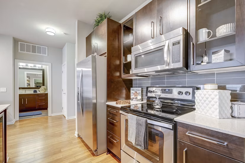 Elegant kitchen with sleek countertops and modern appliances at Alara Union Station Apartments