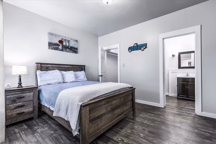 Cozy bedroom with modern decor in The Court at Dorel Apartments