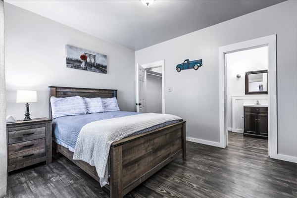 Cozy bedroom with modern decor in The Court at Dorel Apartments