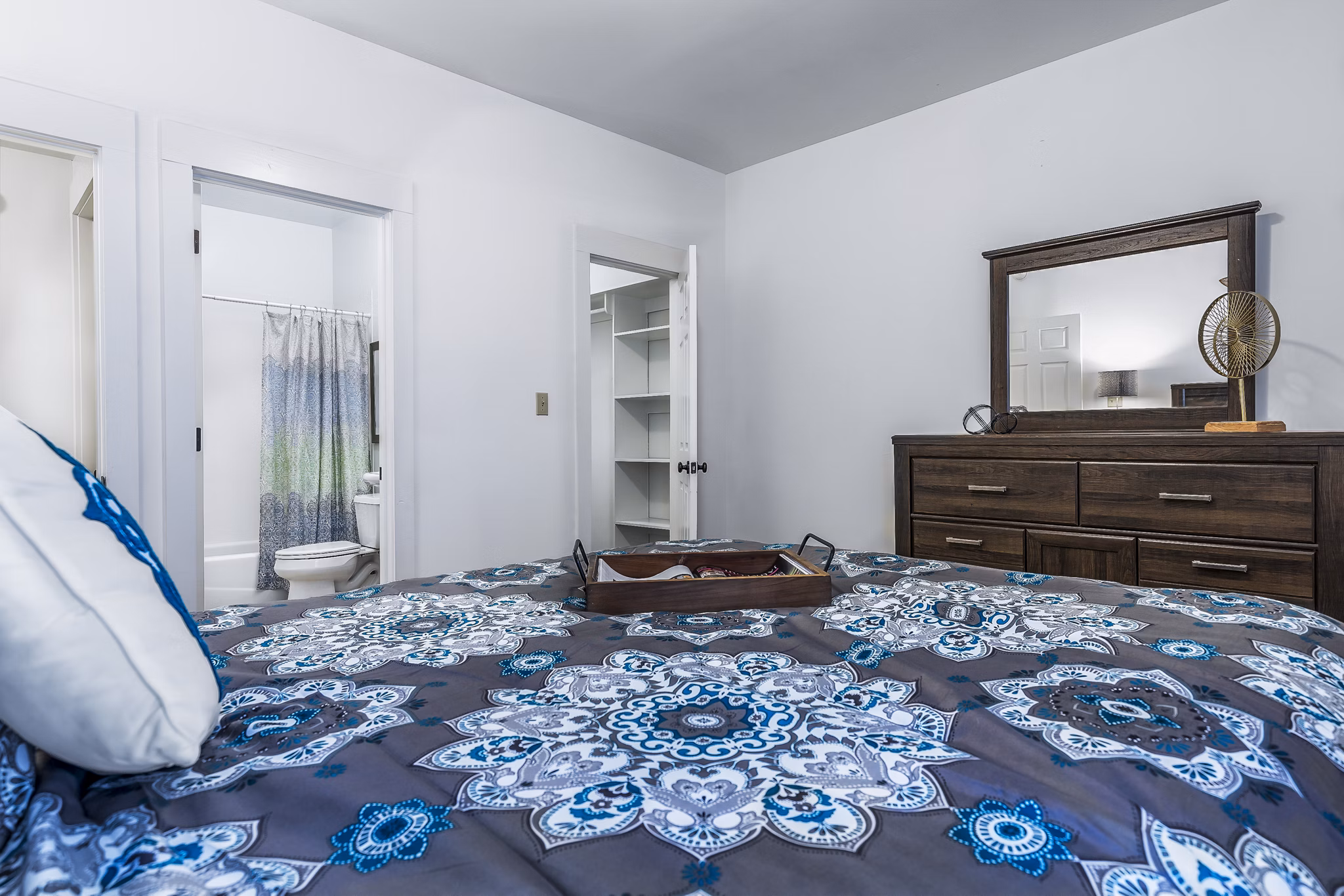 Cozy bedroom with modern decor at The Court at Dorel Apartments