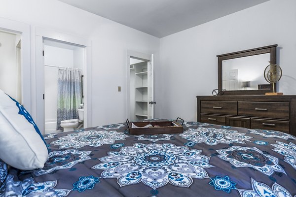 Cozy bedroom with modern decor at The Court at Dorel Apartments
