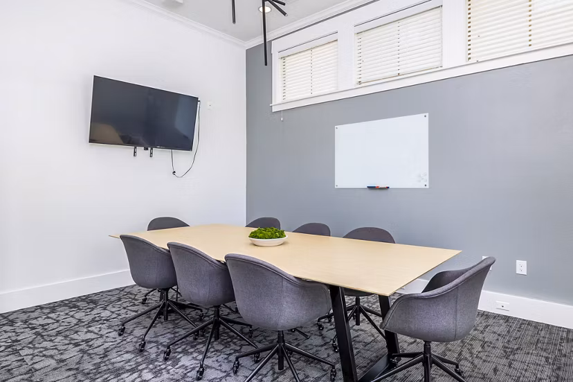 Clubhouse meeting facility with modern furnishings at The Dorel/Girard Court Apartments, ideal for community gatherings and events