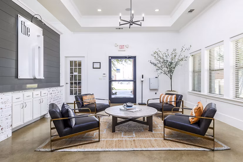 Clubhouse lobby featuring modern seating and decor at The Dorel/Girard Court Apartments