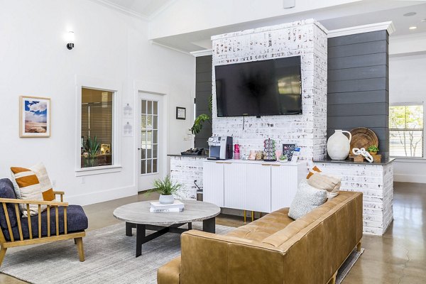 Clubhouse lobby featuring contemporary design and plush seating at The Dorel, Girard Court Apartments