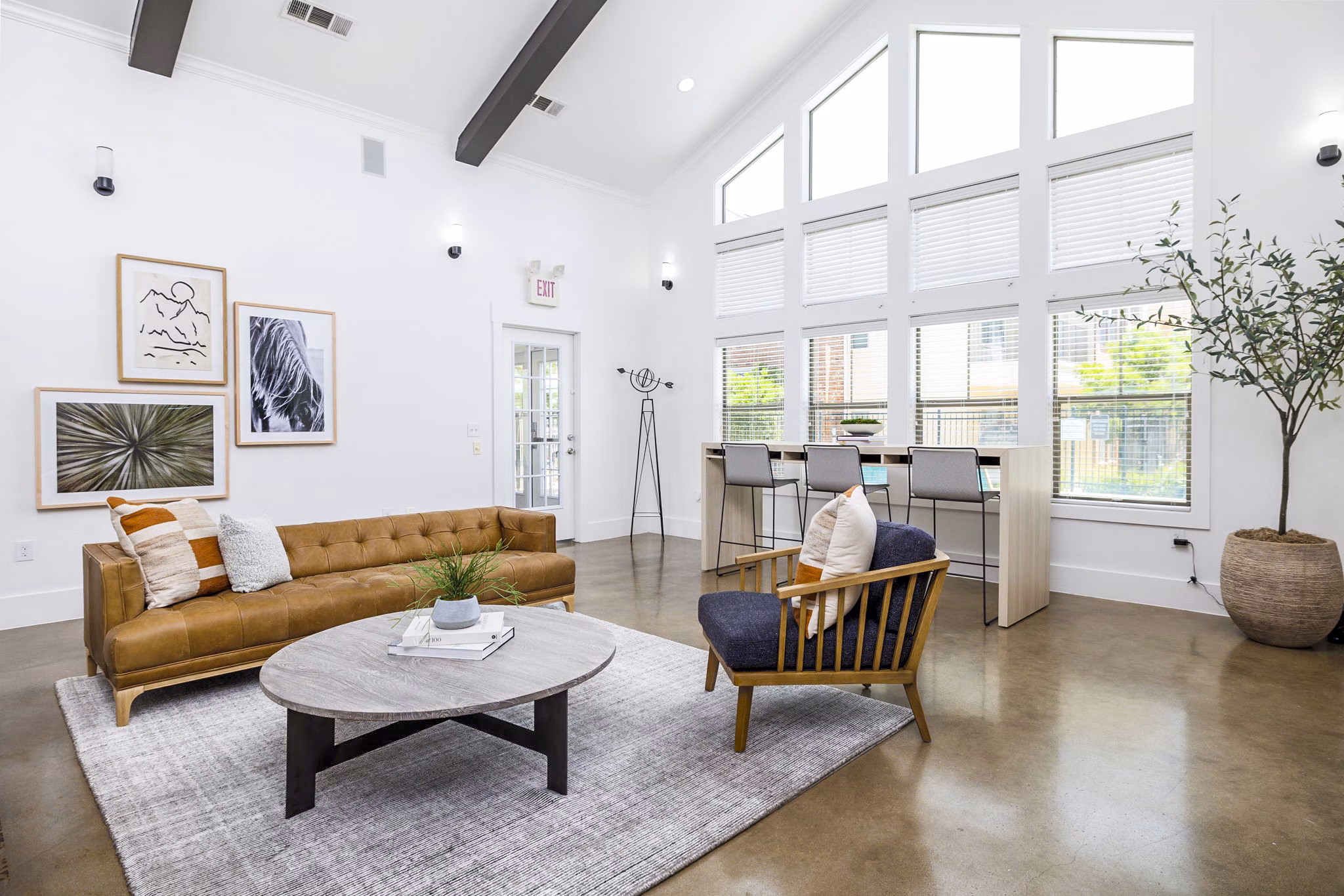 Clubhouse lobby featuring modern decor and seating at The Dorel/Girard Court Apartments