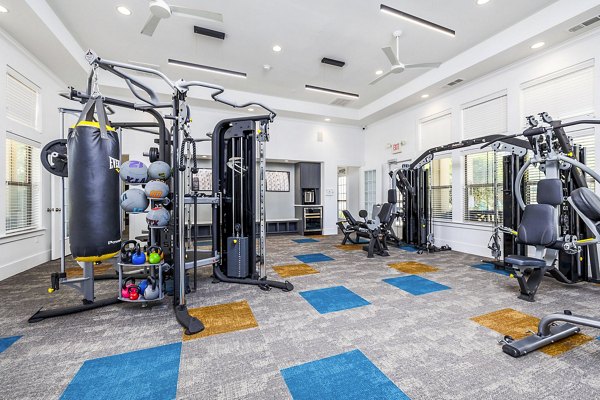 Modern fitness center at The Dorel/Girard Court Apartments featuring state-of-the-art equipment for luxury living experiences