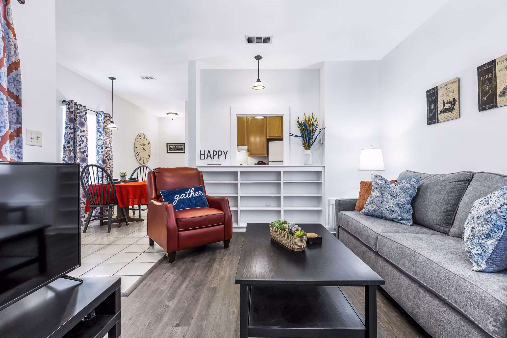 Modern living room with cozy furnishings at The Court at Dorel Apartments, showcasing luxury living