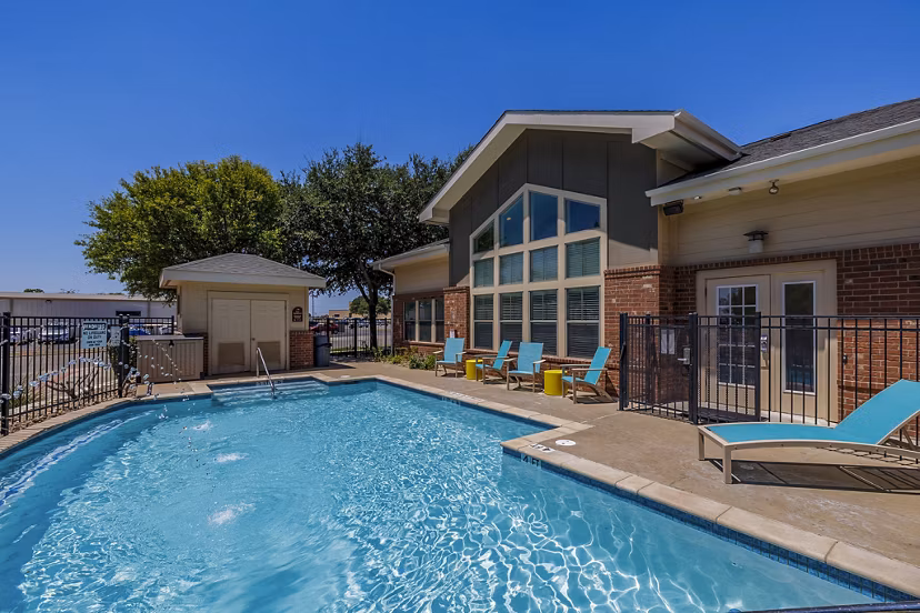 Modern outdoor pool at The Dorel/Girard Court Apartments with landscaped surroundings and spacious lounging area