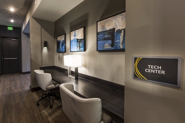 Business center with modern workstations at Anderson Flats Apartments in Greystar's luxury collection