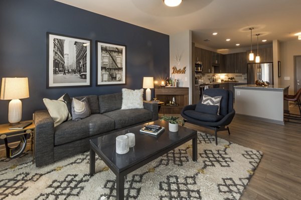 Modern living room with stylish furnishings at Anderson Flats Apartments, a luxury property by Greystar