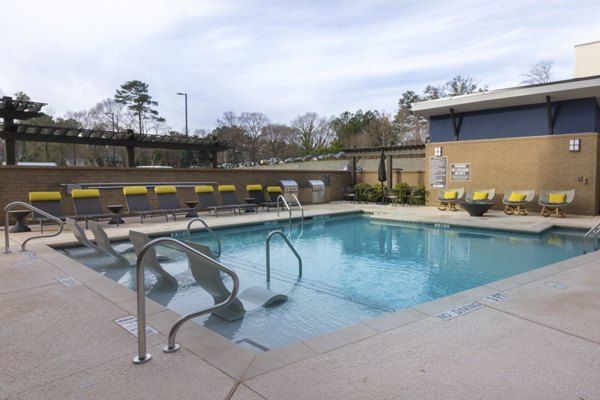 Sparkling outdoor pool at Anderson Flats Apartments, ideal for relaxation and recreation in a luxurious setting