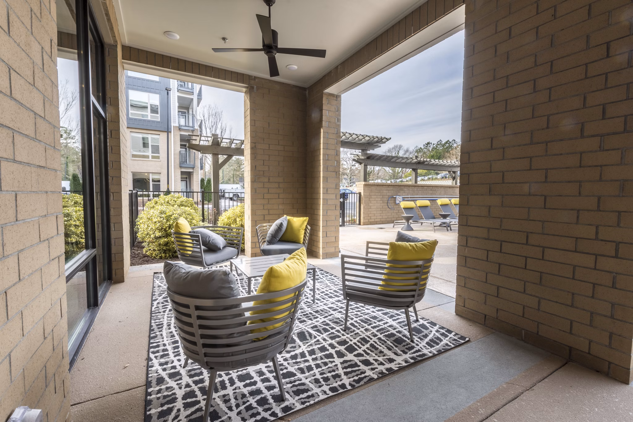 Private patio with modern seating at Anderson Flats Apartments offering luxury outdoor living spaces