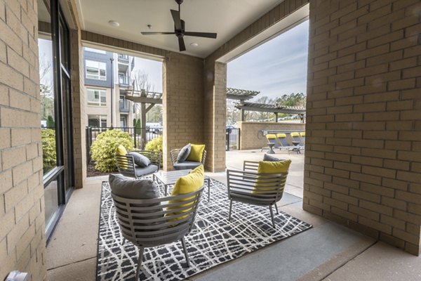 Private patio with modern seating at Anderson Flats Apartments offering luxury outdoor living spaces