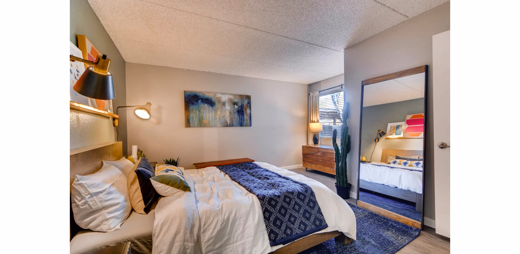 Cozy bedroom with plush bedding and modern design at The Glen at Old Town Apartments
