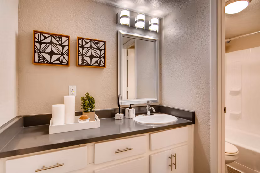Modern bathroom with dual sinks and stylish fixtures in The Glen at Old Town Apartments