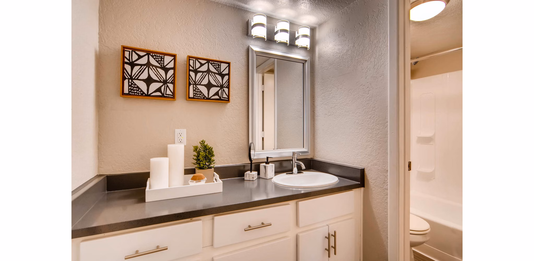 Modern bathroom with dual sinks and stylish fixtures in The Glen at Old Town Apartments
