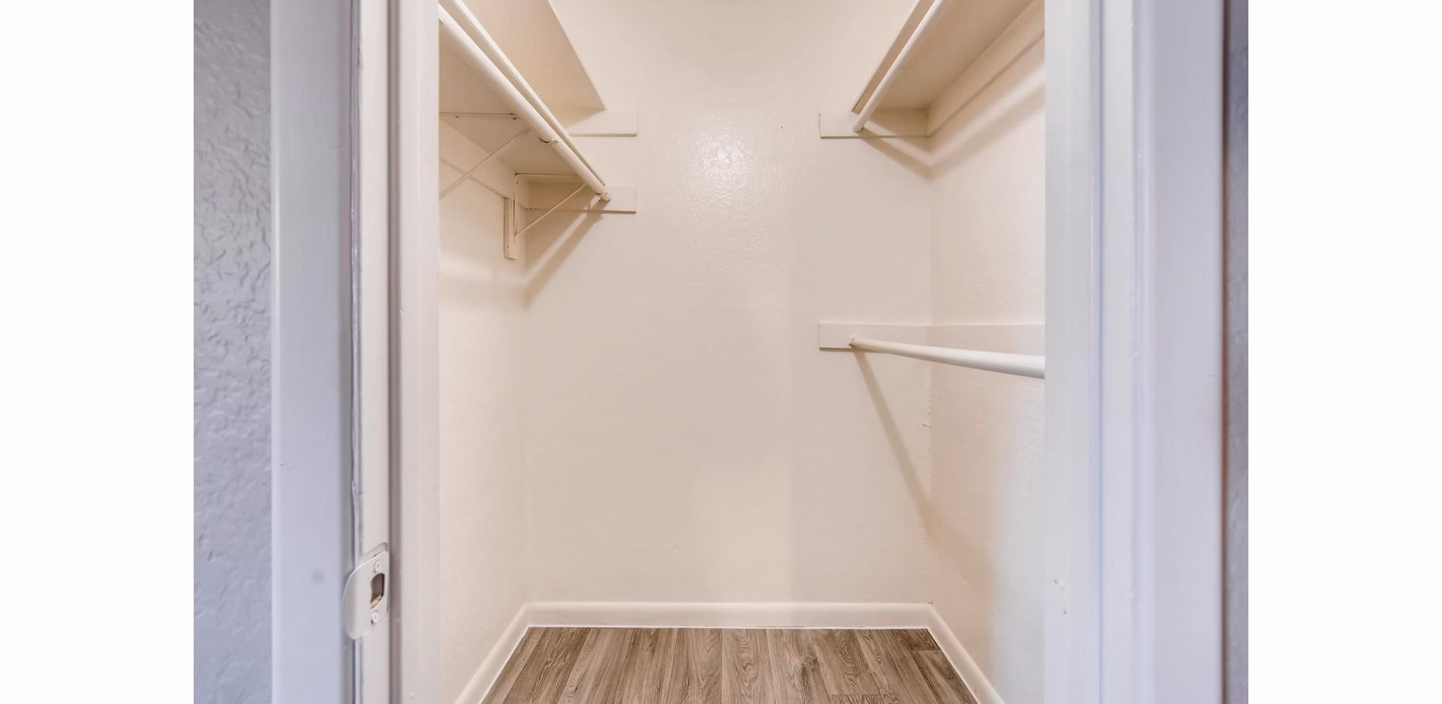 Walk-in closet with custom shelving at The Glen at Old Town Apartments